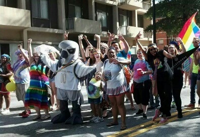 OUtlet members and Petey the Petrel march in the Atlanta Pride Parade last October.