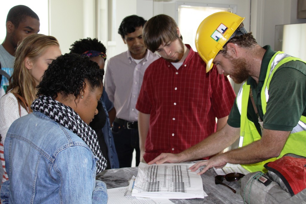 Matthew Anthony, Project Manager for Southface LEED for Homes, shows students sustainability measures implemented at Gables Brookhaven.