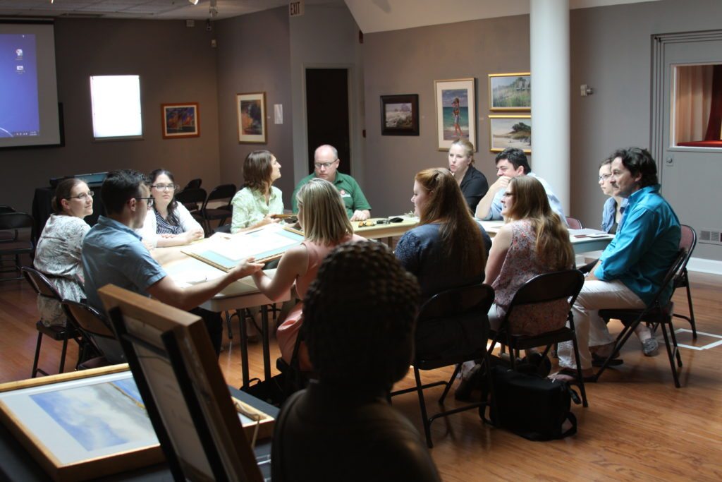 Johns Hopkins graduate students hear from OUMA Director Elizabeth Peterson and Collections Manager John Tilford.