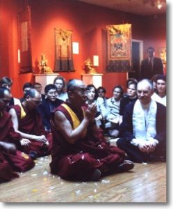 Guests and monks seated with the Dali Lama.