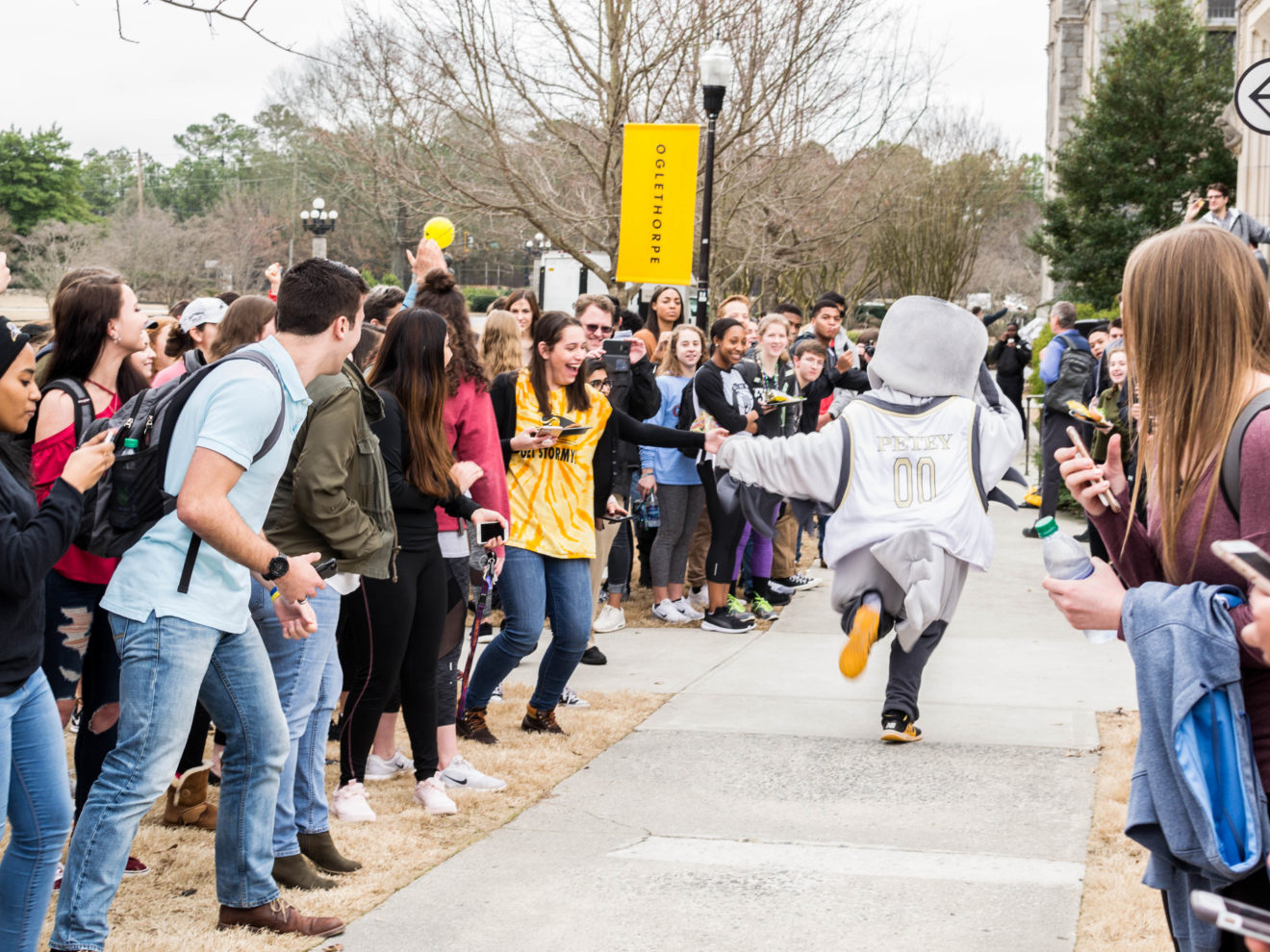 Petey high-fives a student at the annual Petrels of Fire footrace