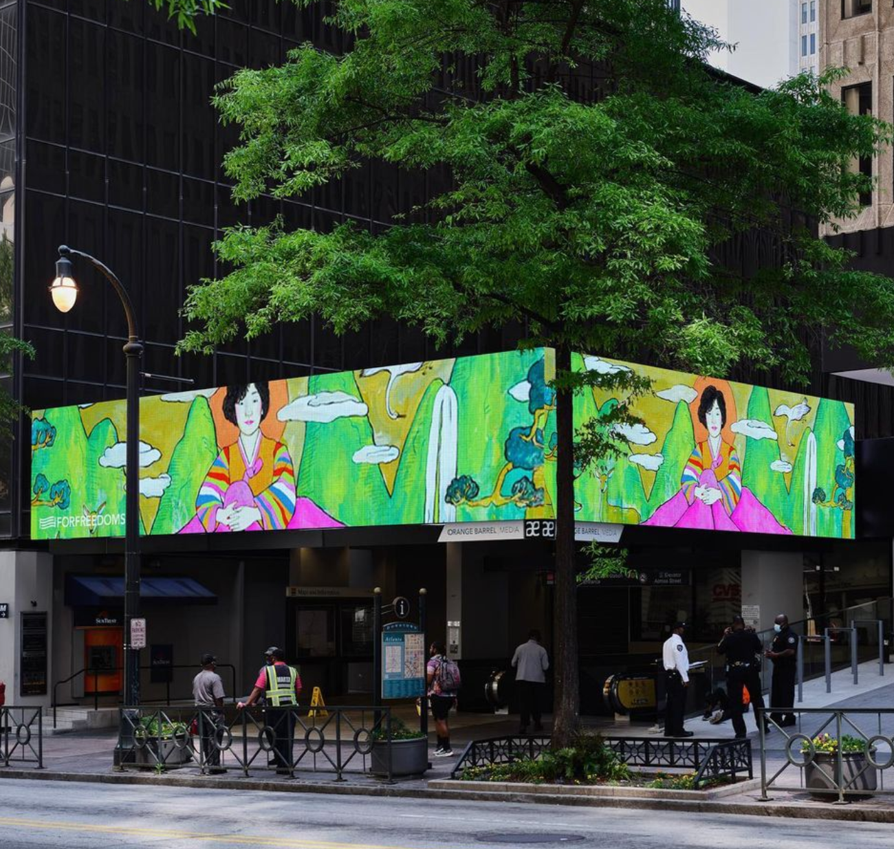 OU Alum Nicole Kang's art displayed above Peachtree Station in Downtown Atlanta
