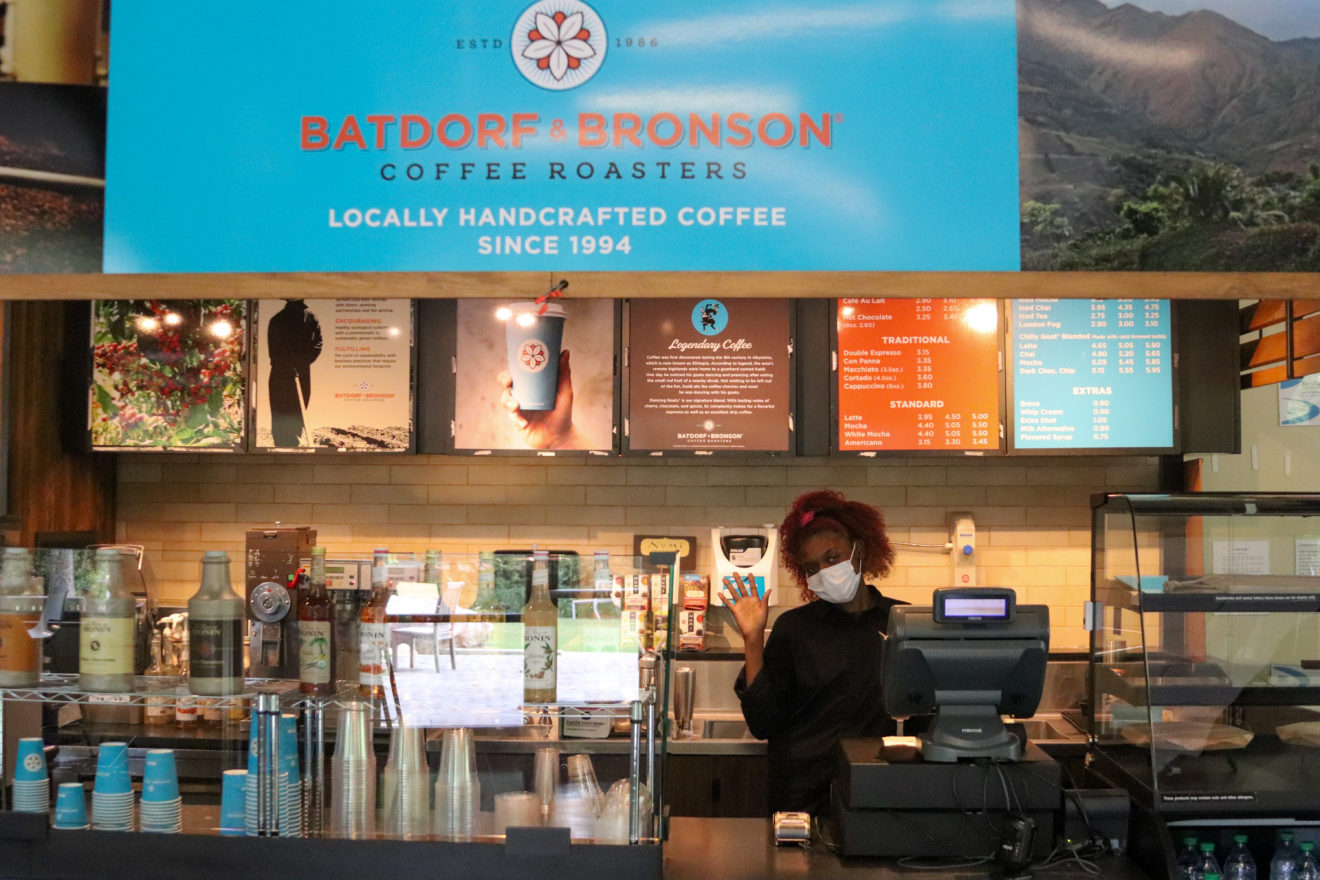 A student worker waves at the counter of "Stormy Brews," the new coffee shop in Oglethorpe's Turner Lynch Campus Center