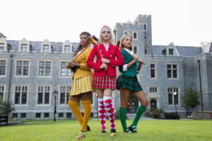 Oglethorpe Theatre students Wynne Kelly '24 (in green) and Chloe Campbell '24 (in yellow) pose for a "Heathers" promo shoot