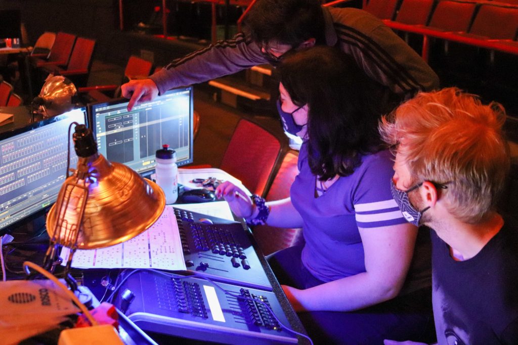 OU Students Justin Martin and Emily Scoular work the light board for Heathers: the Musical