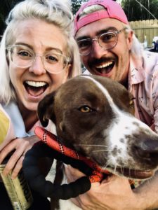 Whitney Lewis with her husband and dog.