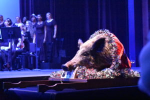 The ceremonial boar's head on stage during the Boar's Head concert