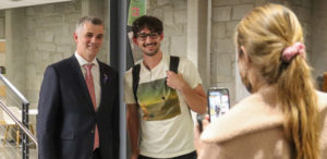 Student poses with Kristjan Prikk, Ambassador of Estonia to the United States