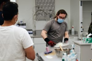 An Oglethorpe student prepares flash ice cream at Atlanta Science Festival