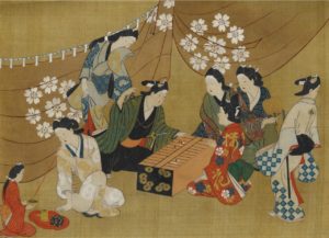 Fragment of a hand scroll mounted as a hanging scroll, painted in ink, colors, and gold on silk with beauties and dandies engaged in a board game before a curtain decorated with cherry blossoms