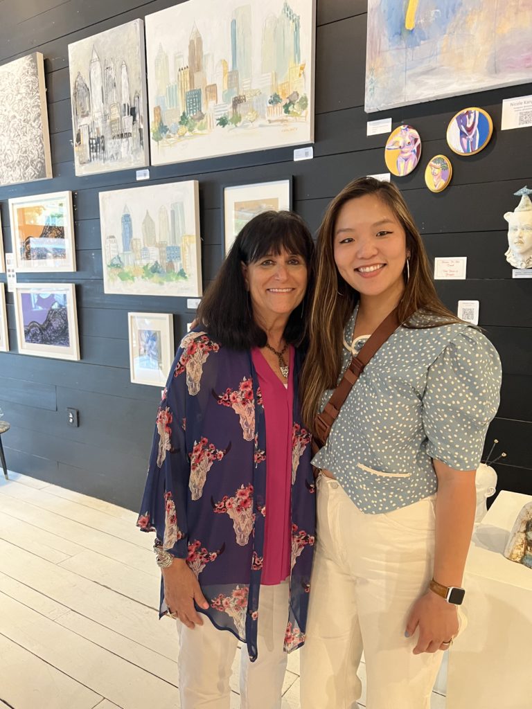 Sharon Moskowitz and Nicole Kang Ahn '13 pose in the pop-up gallery
