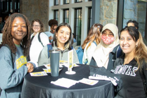 Four Oglethorpe students smile at the First-Generation College Celebration