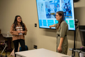 Student Mackenzie Roberson and Jaely Chavez present at the First-Generation Conference