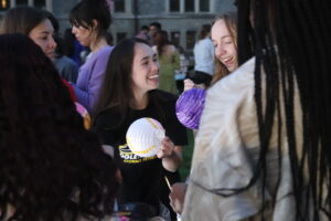 Students smiling while panting lanterns at the World Showcase