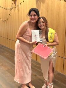 Estela Chavez poses with Aide Salazar after giving her the award "Education is Liberation."